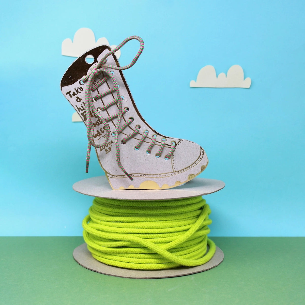 Forager Provisions LTD Ark Colour Design green and pink boot laces on a large spool with a decorative boot cutout