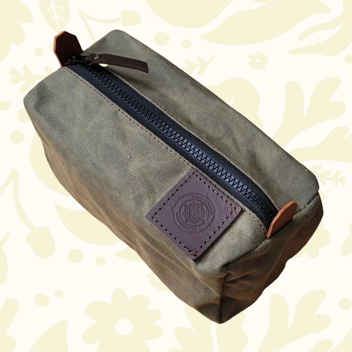 Forager Provisions LTD Journeyman Craft green waxed canvas camping peg case with a durable YKK zipper and leather patch.