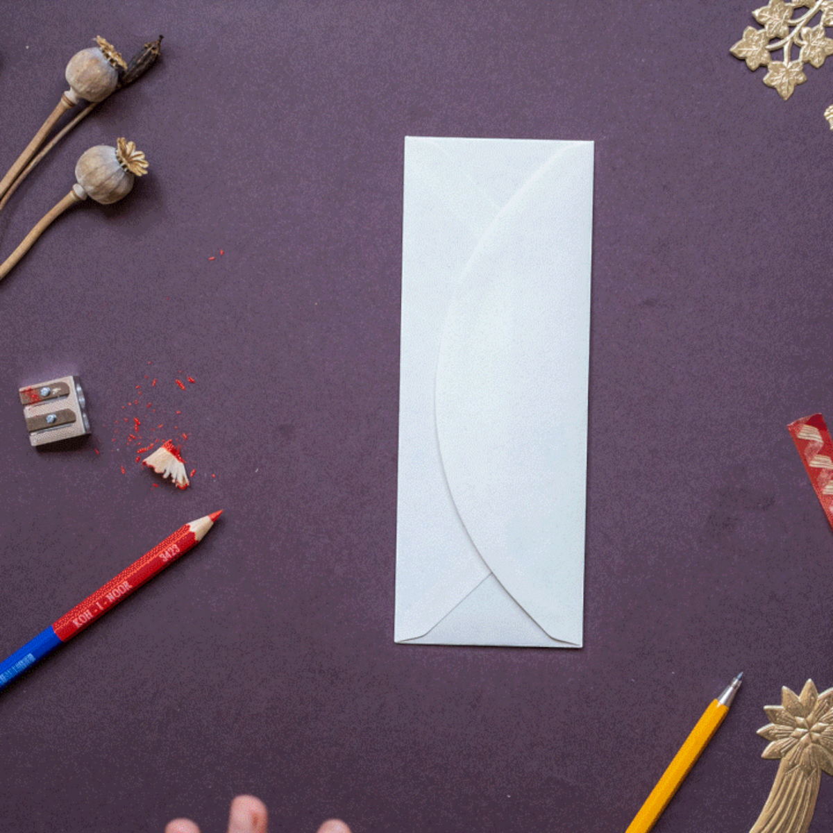 Forager Provisions LTD Hadley Christmas Elf Boy greeting card in a white envelope on a dark purple surface