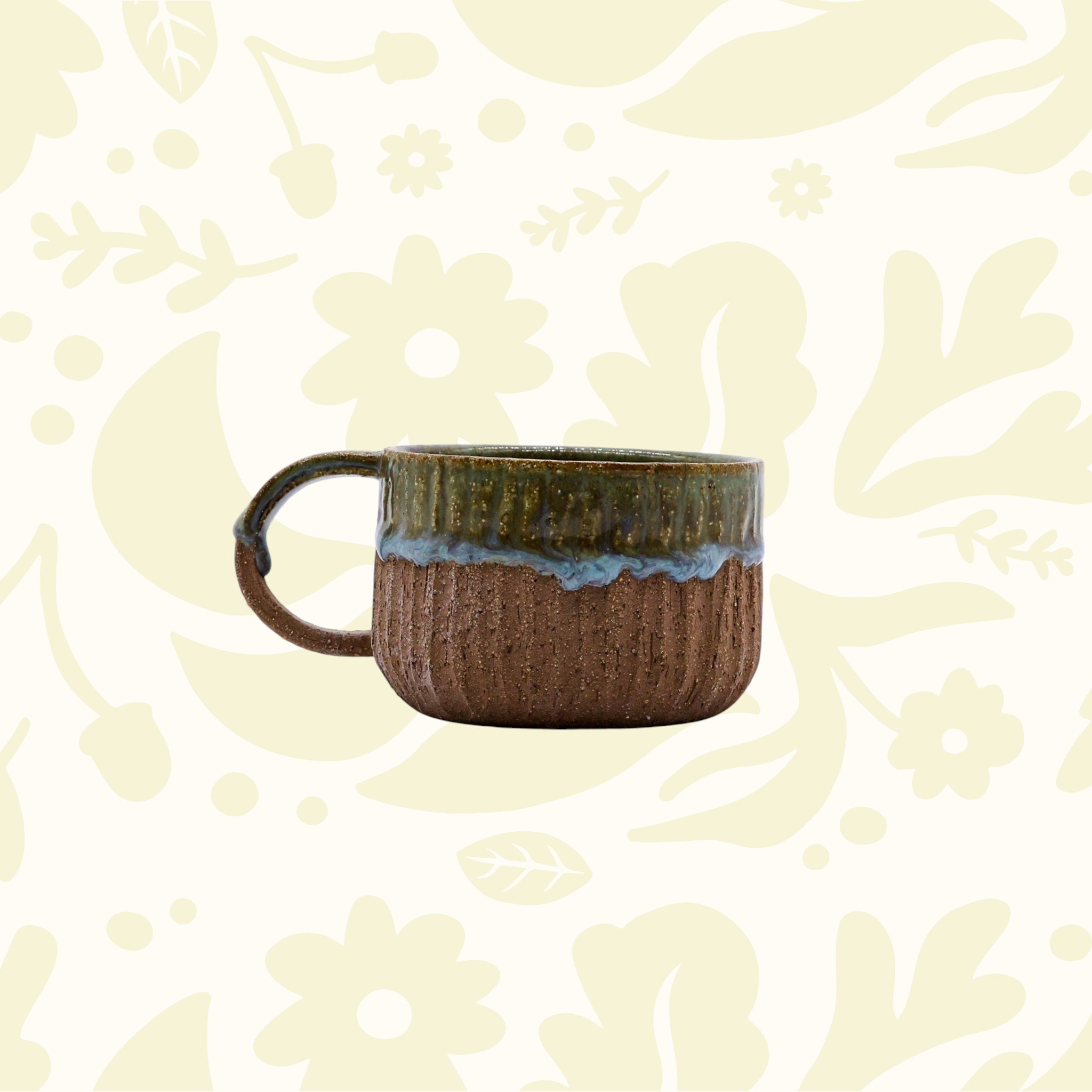 Forager Provisions LTD Ribera Bluverde Arte handmade stoneware mug with a textured brown base and green glazed rim.