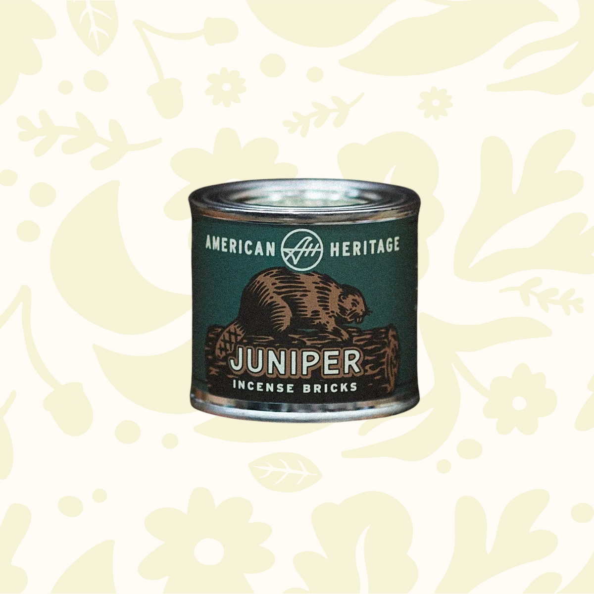 Forager Provisions LTD American Heritage Brands Juniper incense bricks in a green tin resting on vintage books.