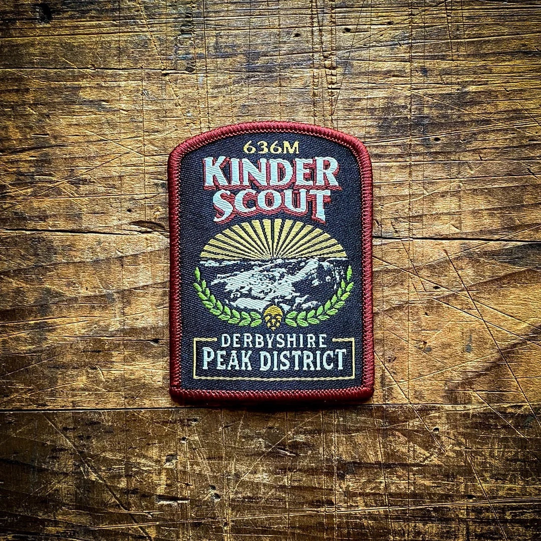 Forager Provisions LTD Kinder Scout embroidered patch featuring a mountain landscape on a dark background.