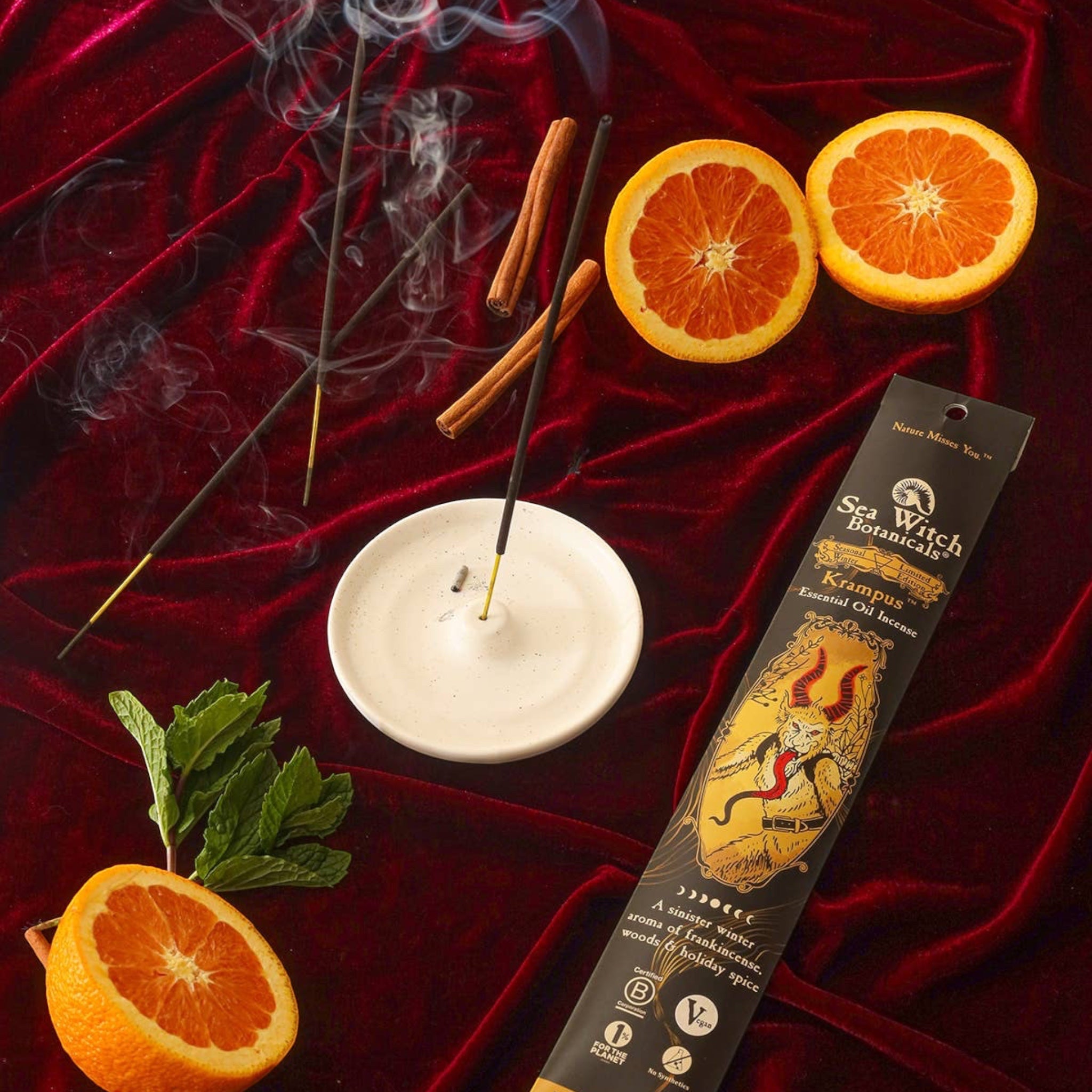 Forager Provisions LTD Sea Witch Botanicals Krampus incense sticks with orange slices, cinnamon, and mint on velvet.