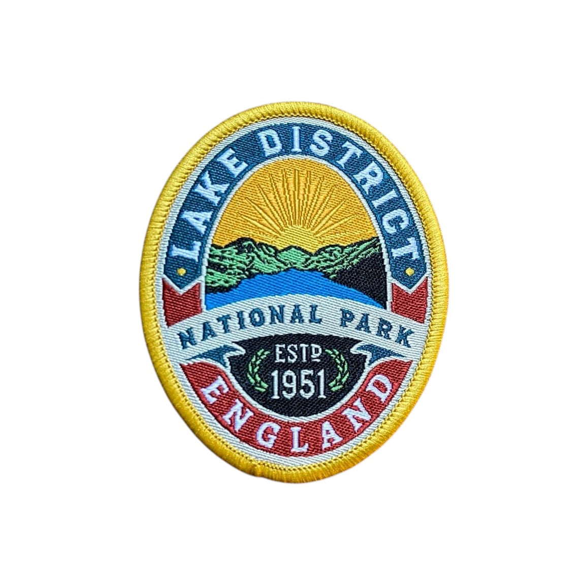 Forager Provisions LTD Lake District National Park embroidered patch featuring hills, lake, and sun on a wooden surface.