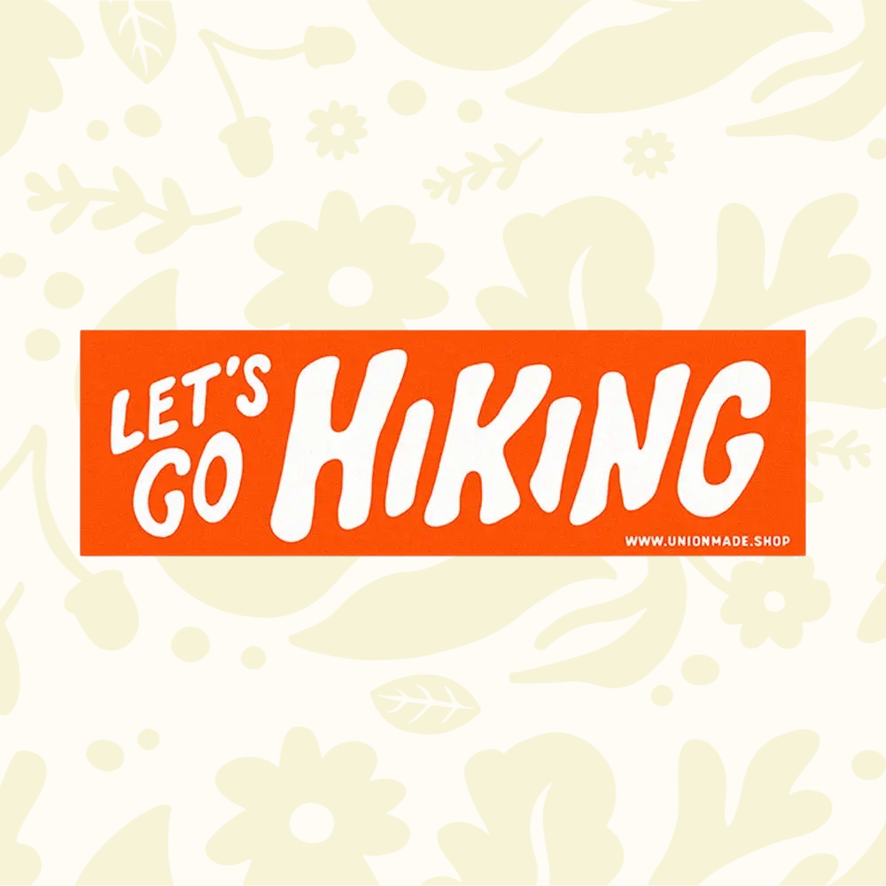 Forager Provisions LTD orange waterproof vinyl bumper sticker with bold white Lets Go Hiking text for outdoor gear