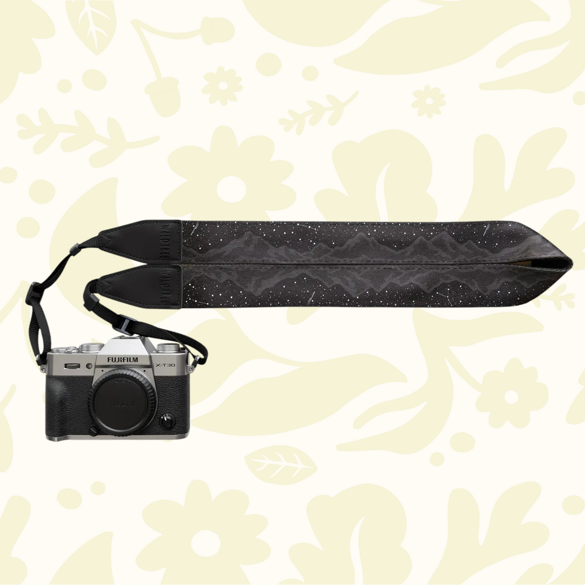Forager Provisions LTD Wildtree Midnight Mountain camera strap with starlit peak graphic attached to a Fujifilm camera.
