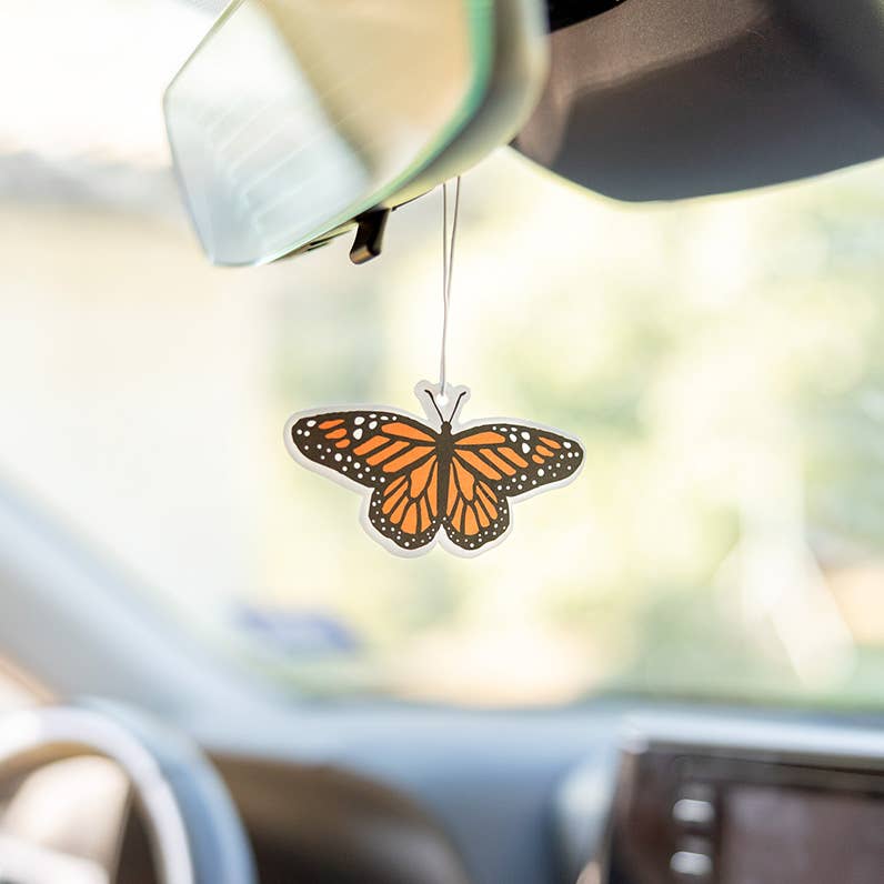 Forager Provisions LTD monarch butterfly air freshener hanging from a car rearview mirror with lavender scent