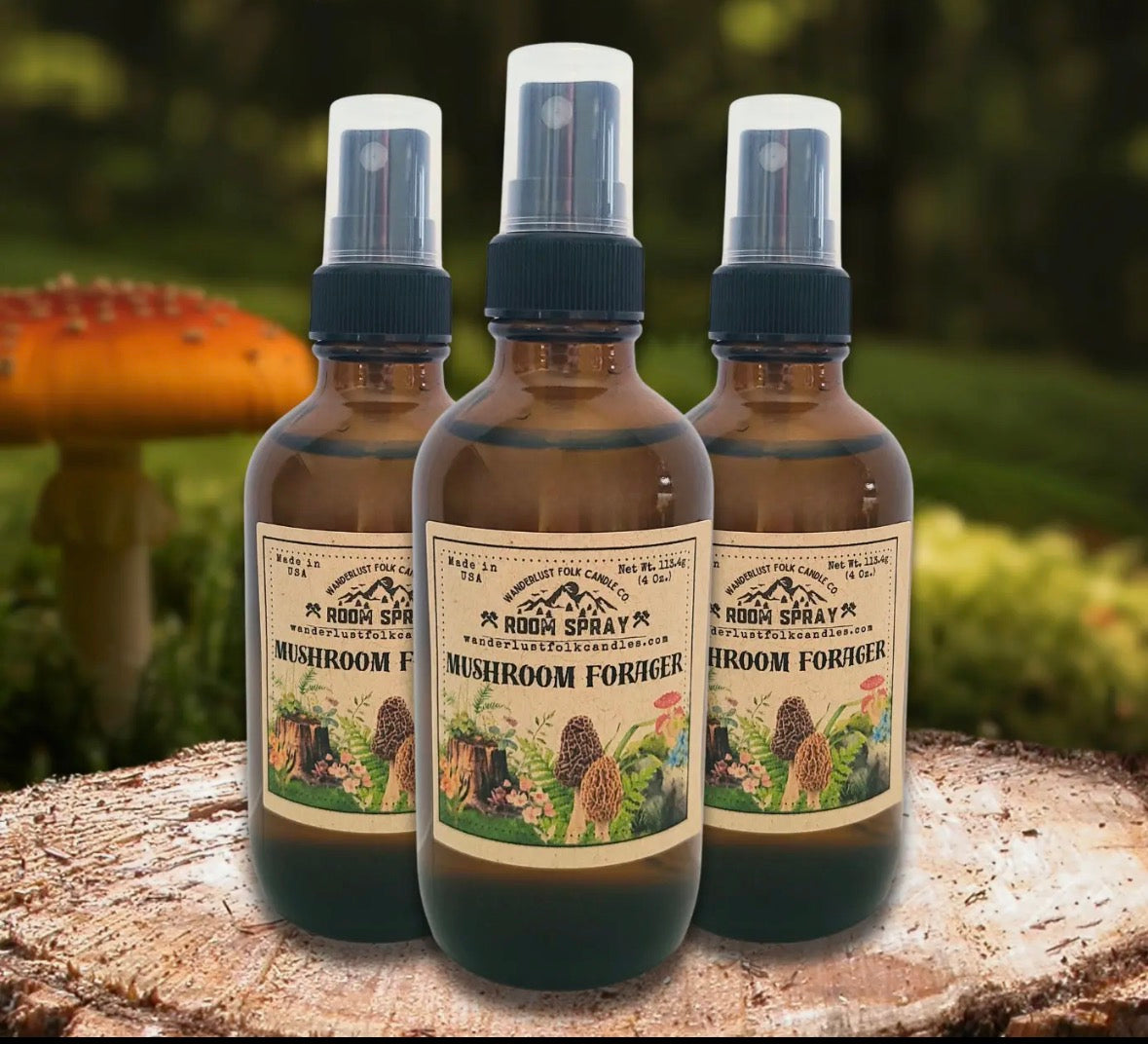 Forager Provisions LTD Wanderlust Folk The Mushroom Forager room spray bottles on a wooden log in a forest setting