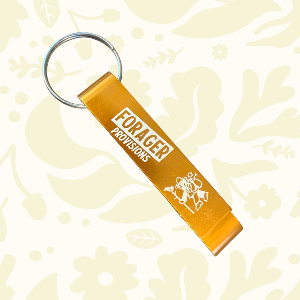 Forager Provisions LTD orange metal bottle opener keyring with white logo and hiker graphic