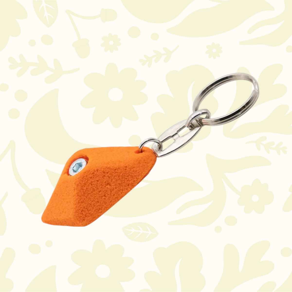 Forager Provisions LTD Seven Peaks orange climbing hold keychain with a metal split ring for keys and gear.