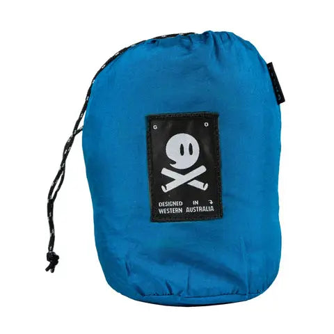 Forager Provisions LTD Ghost Outdoors peacock blue packable travel hammock in its compact drawstring storage bag.