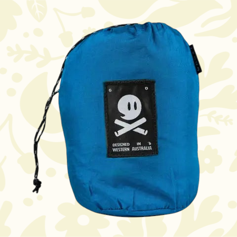 Forager Provisions LTD Ghost Outdoors peacock blue packable travel hammock in its compact drawstring storage bag