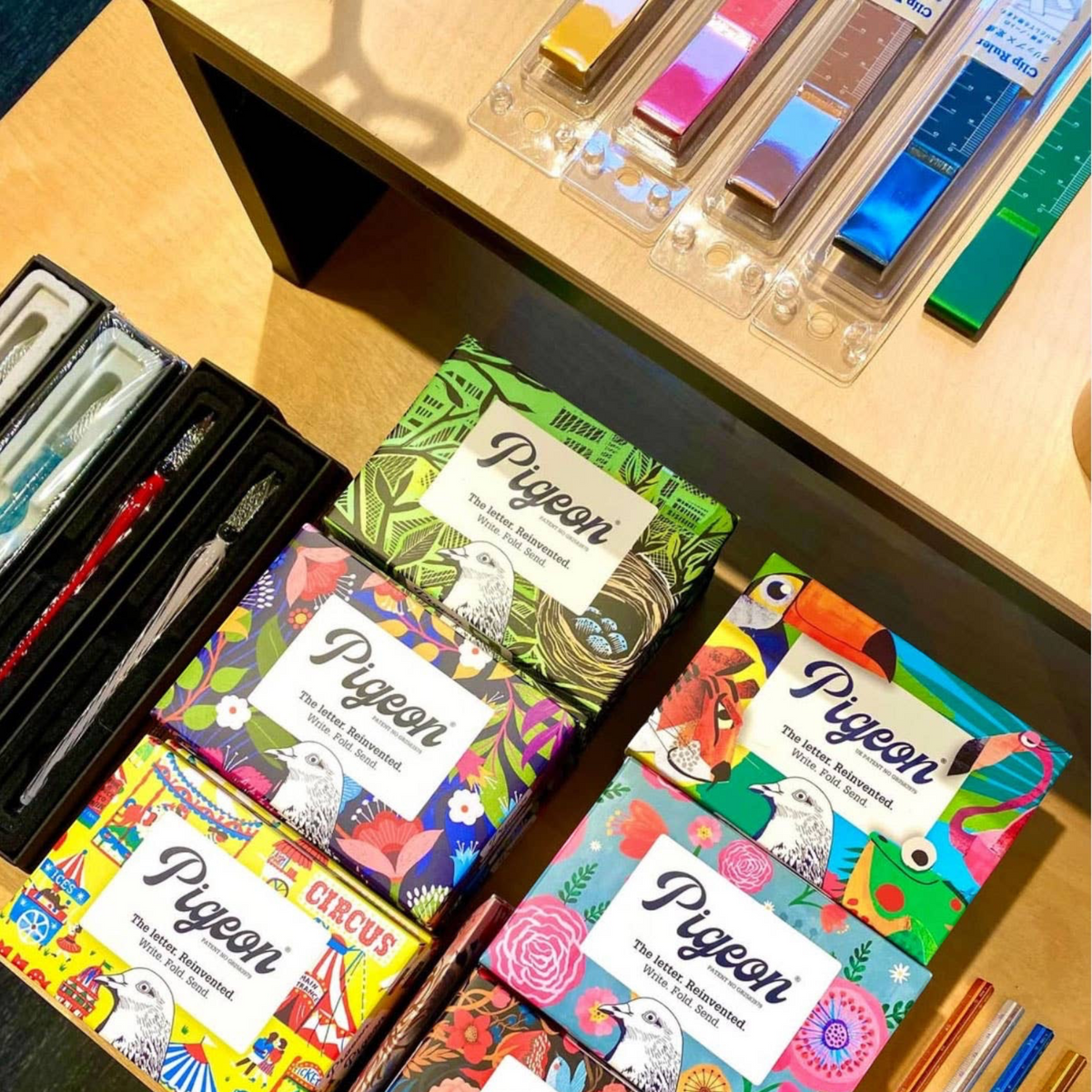 Forager Provisions LTD Pigeonposted folding letter sets with colourful nature and circus illustrations on display.