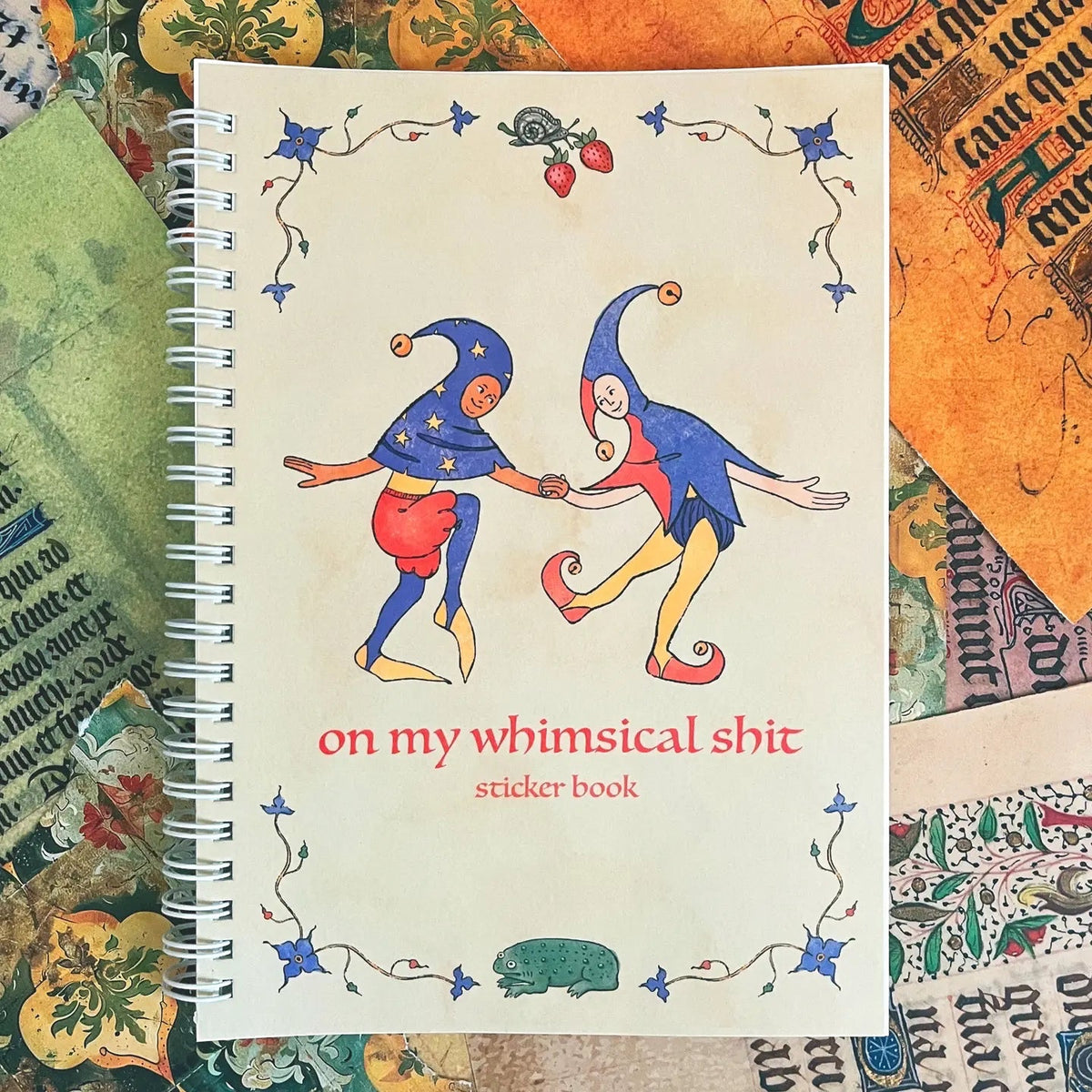 Forager Provisions LTD reusable sticker book featuring whimsical medieval jester illustrations on a spiral-bound cover.