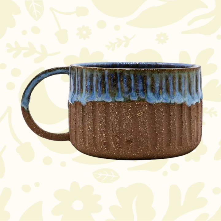 Forager Provisions LTD Ribera Bluvio Arte handmade stoneware mug with a textured brown base and blue drip glaze.