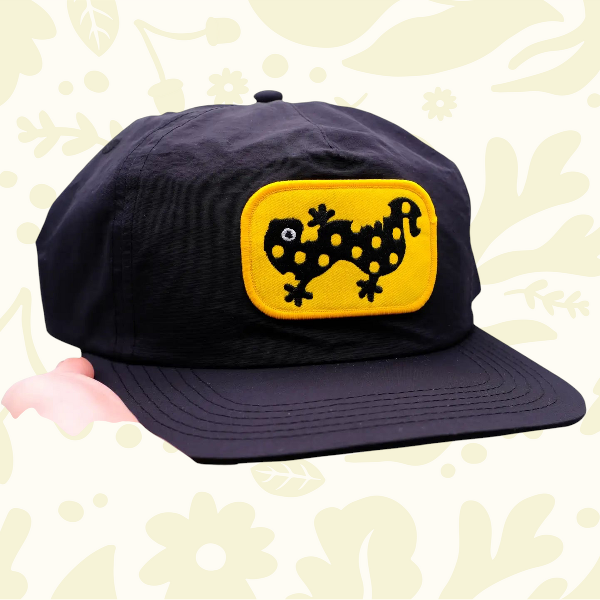 Forager Provisions LTD black cotton ball cap featuring an embroidered yellow spotted salamander patch