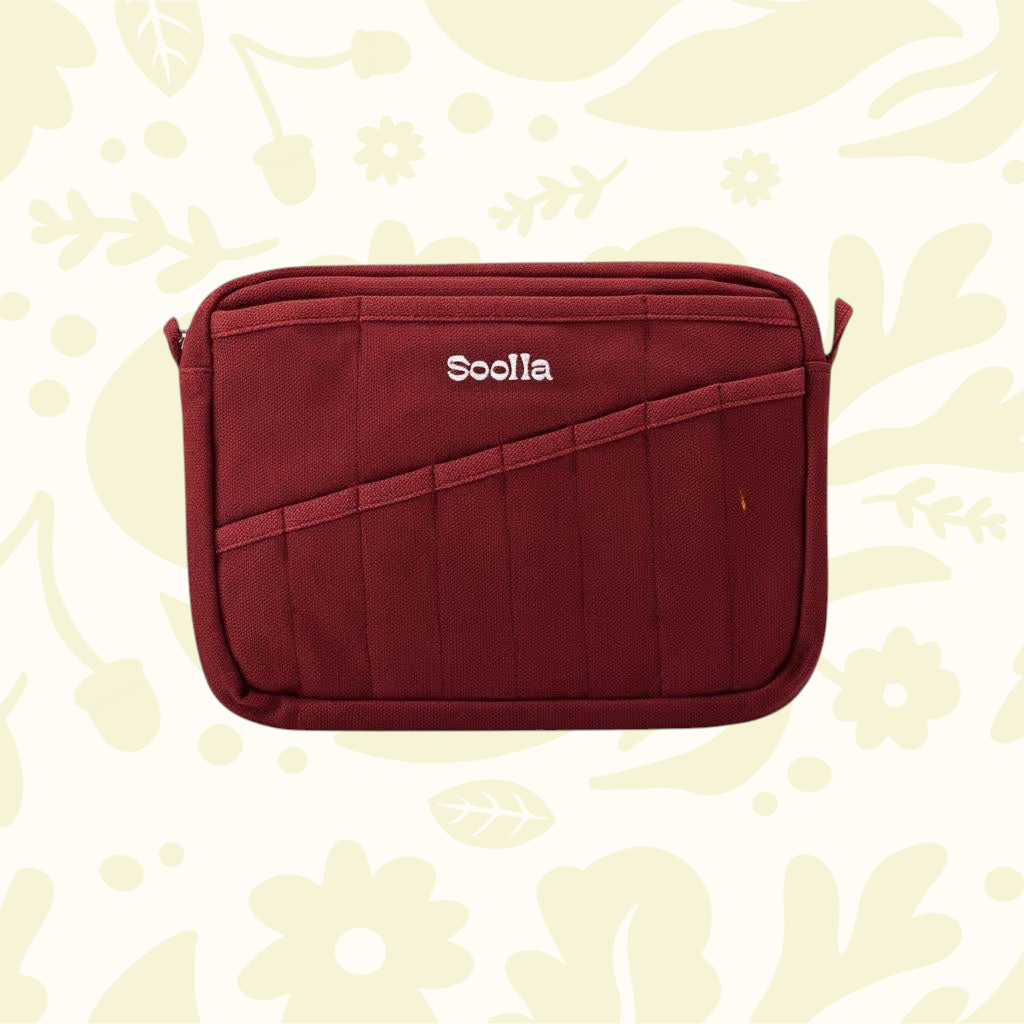 Soolla® Studio Artist Stationery Pouch Sangria, rectangular case displayed on a light floral patterned background.