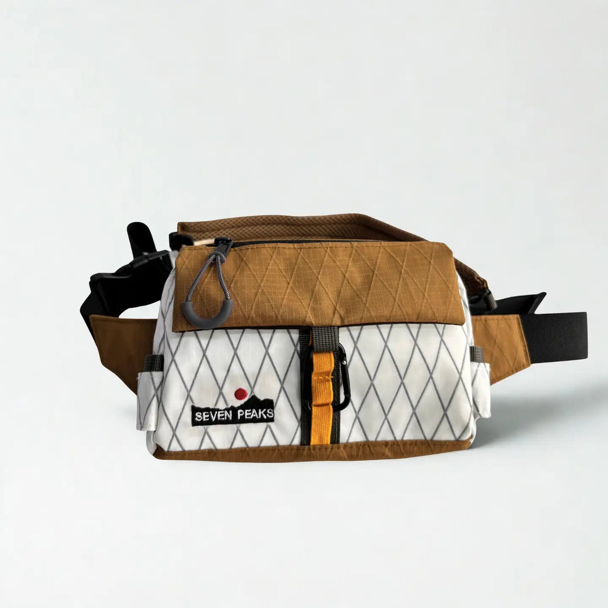 Forager Provisions LTD Seven Peaks brown and white technical fanny pack with adjustable strap and carabiner detail.