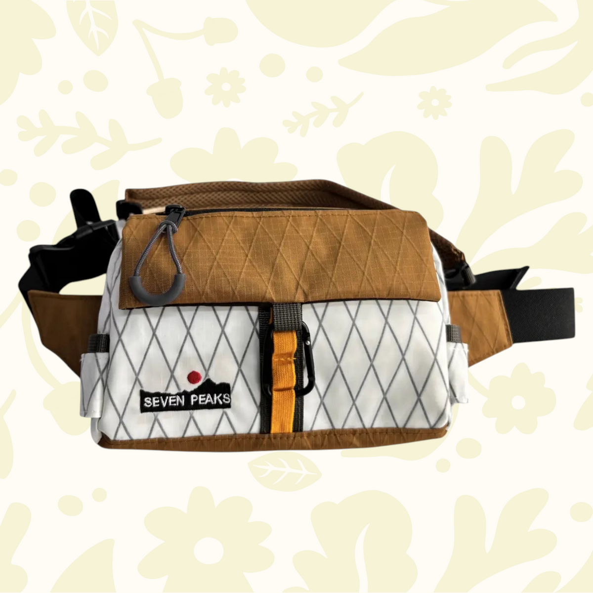 Forager Provisions LTD Seven Peaks fanny pack in brown and white diamond-patterned technical fabric with a carabiner.