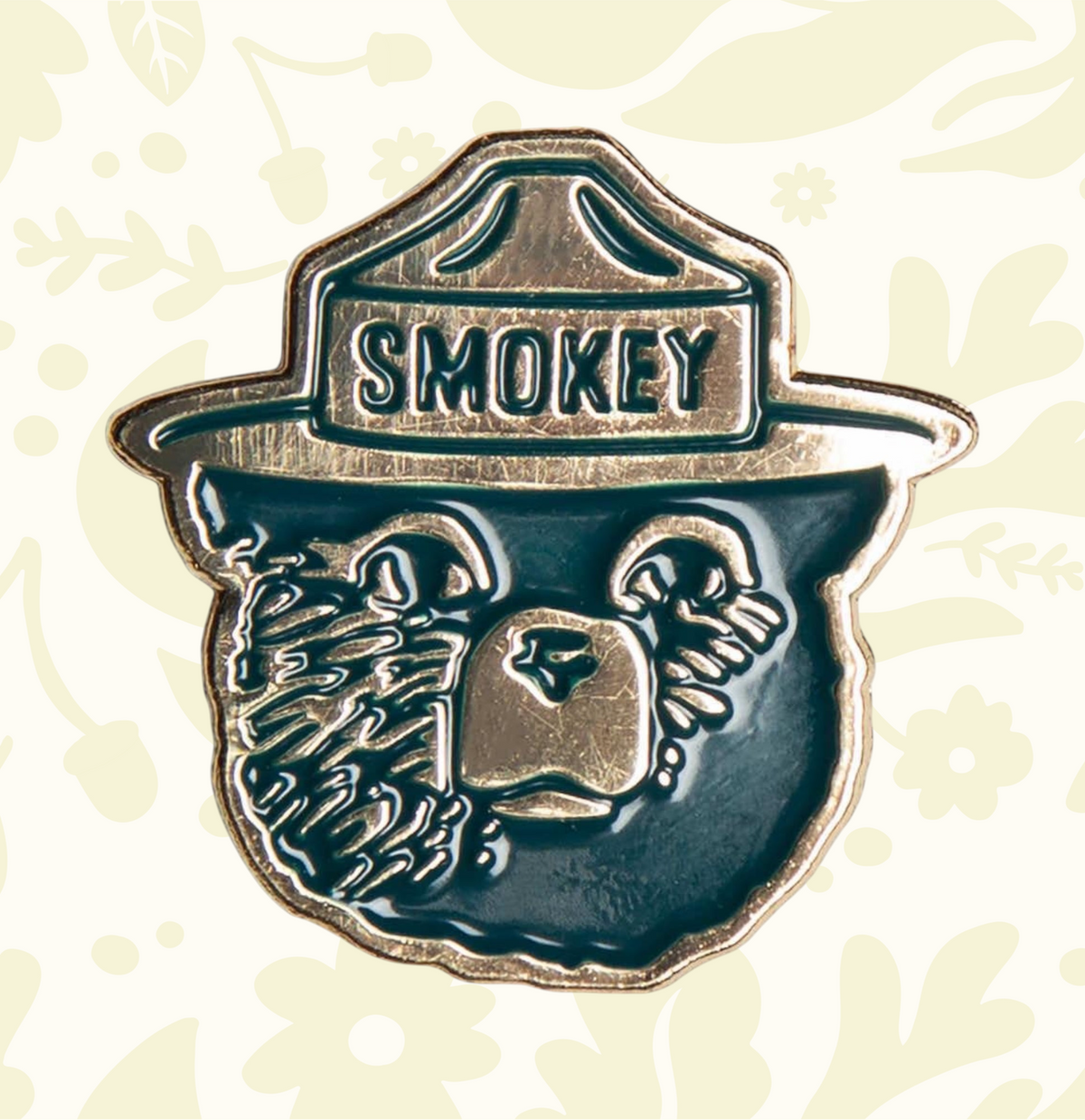 Smokey Bear enamel pin by Landmark Project shows Smokeyâs face and ranger hatâperfect collectible for Smokey Bear fans.