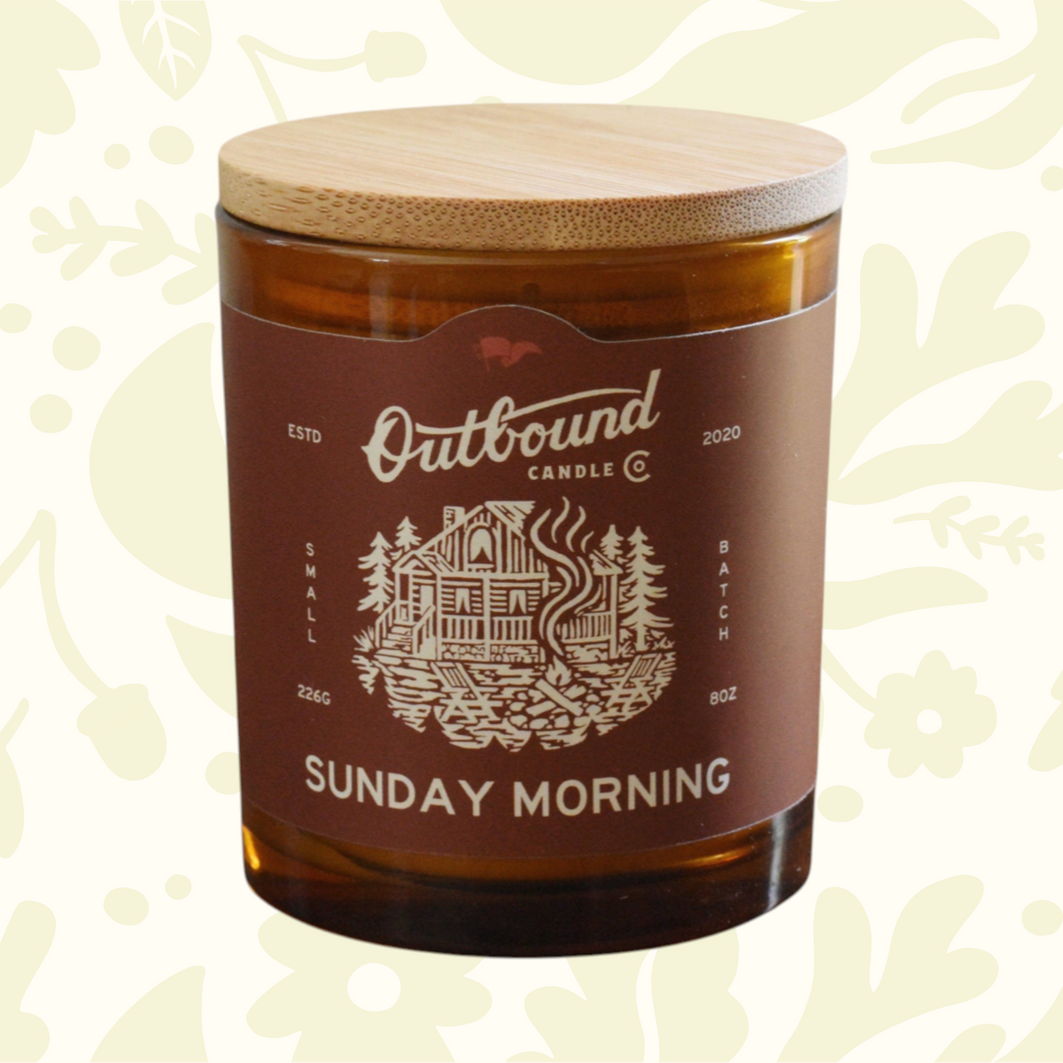 Forager Provisions LTD Outbound Candle Co Sunday Morning soy candle in amber glass jar with a bamboo lid.