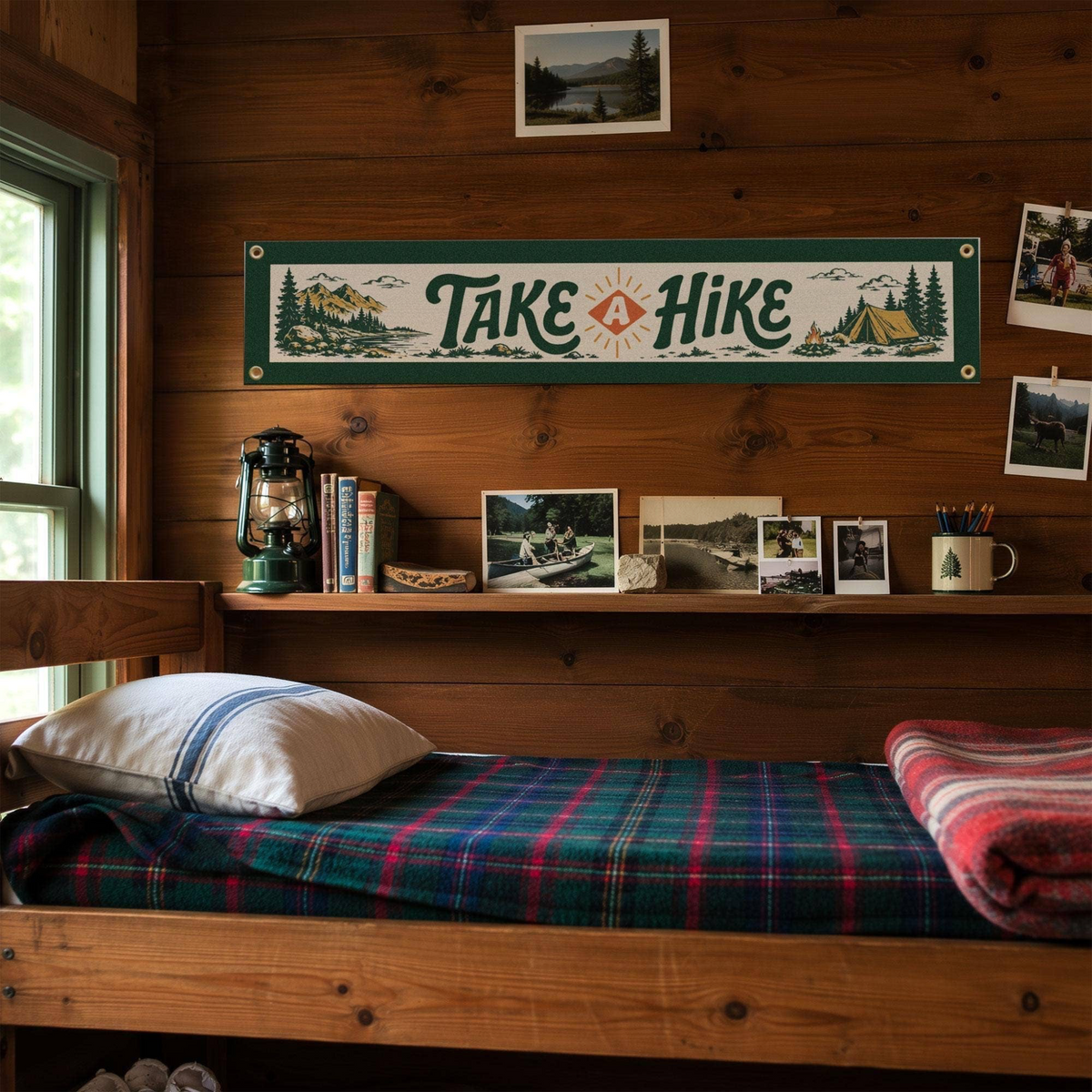 Forager Provisions LTD Benoit's Design Co. Take A Hike felt banner hanging on a rustic wooden cabin wall.