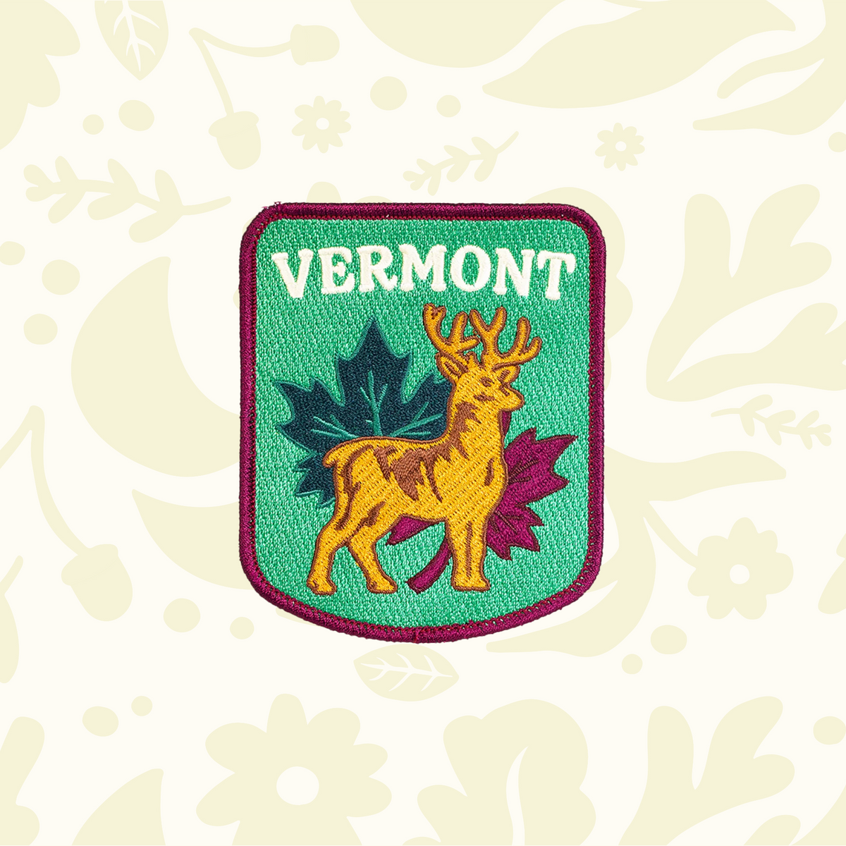 Forager Provisions LTD Oxford Pennant Vermont patch featuring a golden stag and maple leaves on a green background