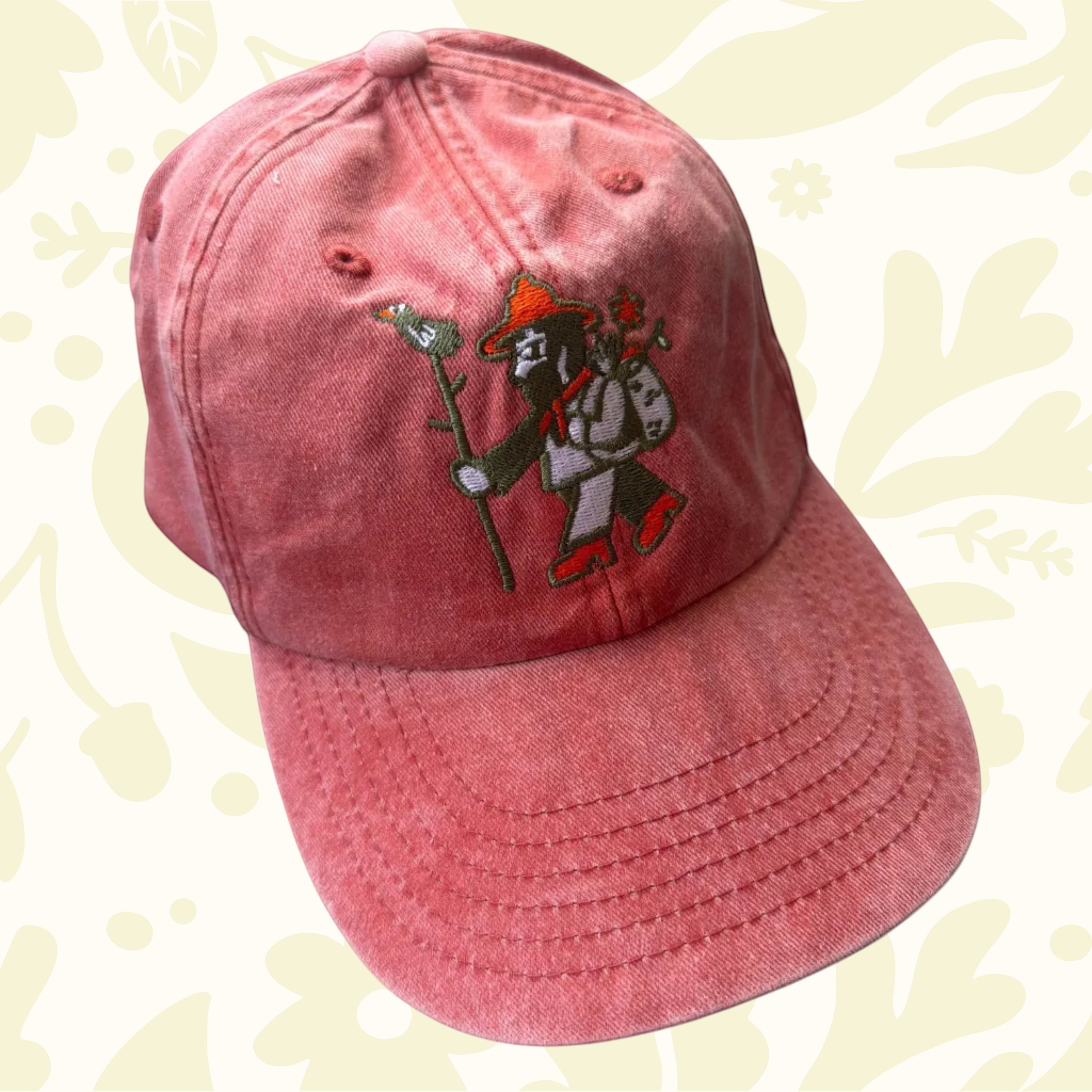 Forager Provisions LTD vintage salmon washed cotton baseball cap with a detailed embroidered outdoor character logo.