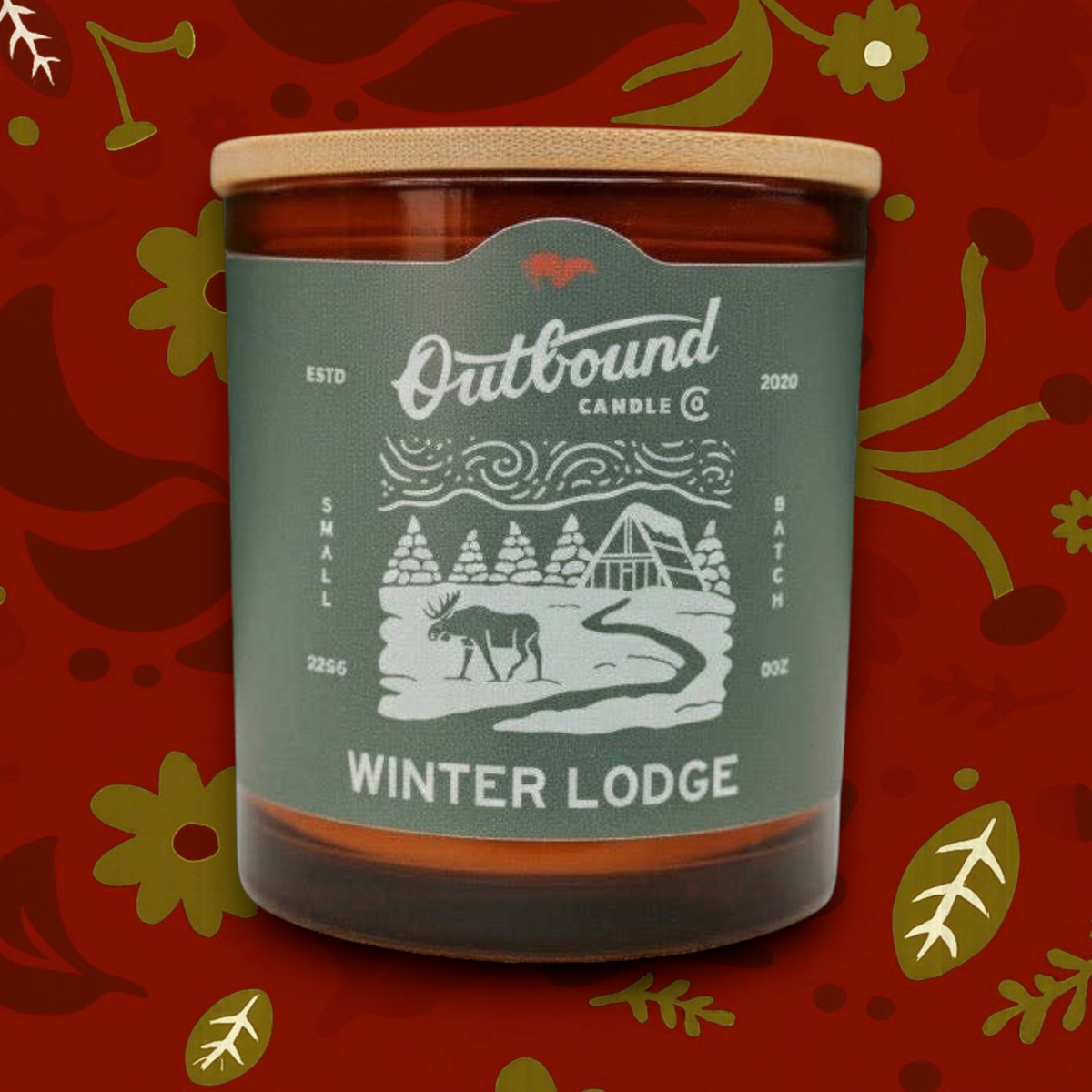 Forager Provisions LTD Winter Lodge 8oz soy candle in an amber glass jar with a bamboo lid and pine forest label.