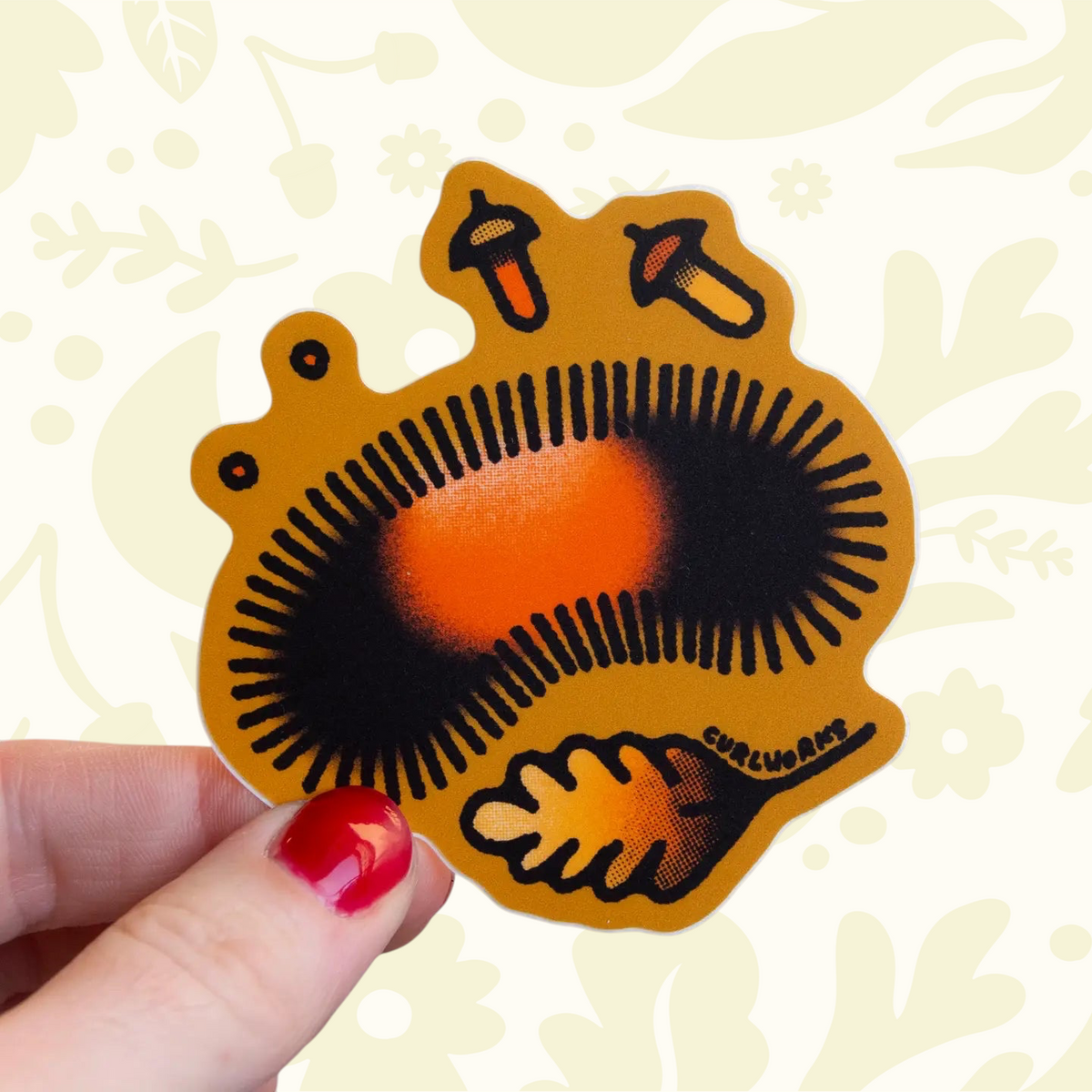 Forager Provisions LTD Wooly Bear vinyl sticker featuring a rust and black caterpillar with acorns on a gold background