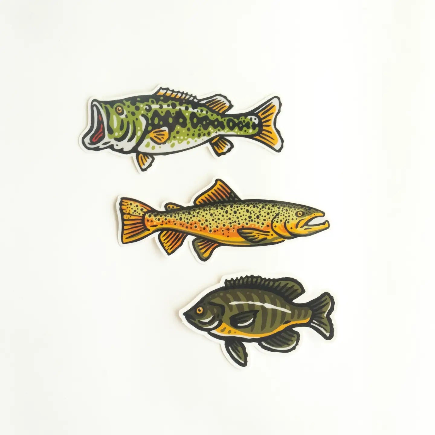 Vertical row of 3 illustrated fish stickers on white background, each with unique green, yellow, orange, and black color patterns.