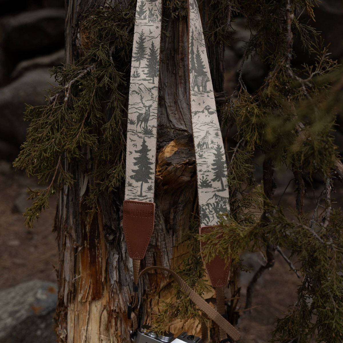 Forager Provisions LTD Wildtree camera strap featuring a woodland mountain landscape print on polyester webbing.
