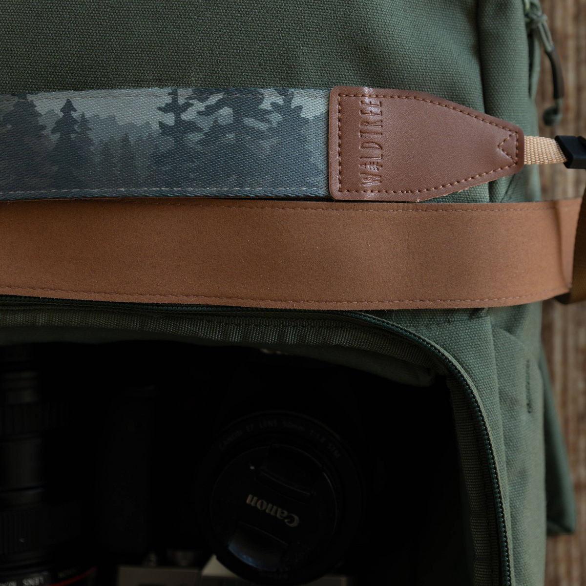 Forager Provisions LTD Wildtree Foggy Forest camera strap with mountain print, brown faux suede, and leather accents.