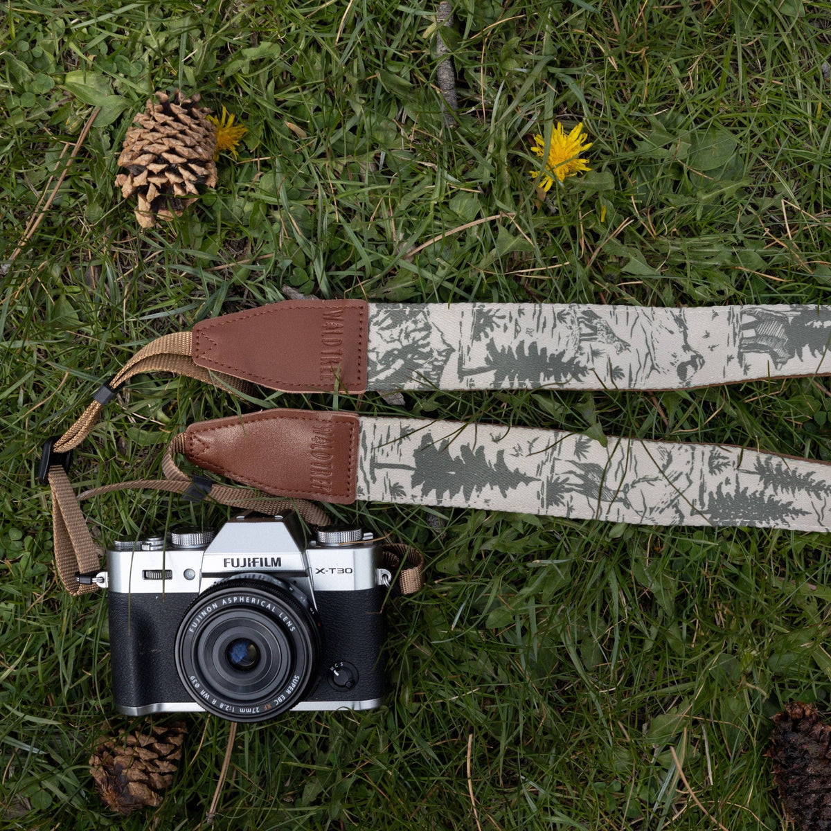 Forager Provisions LTD Wildtree camera strap with woodland landscape print on polyester webbing and brown leather ends.