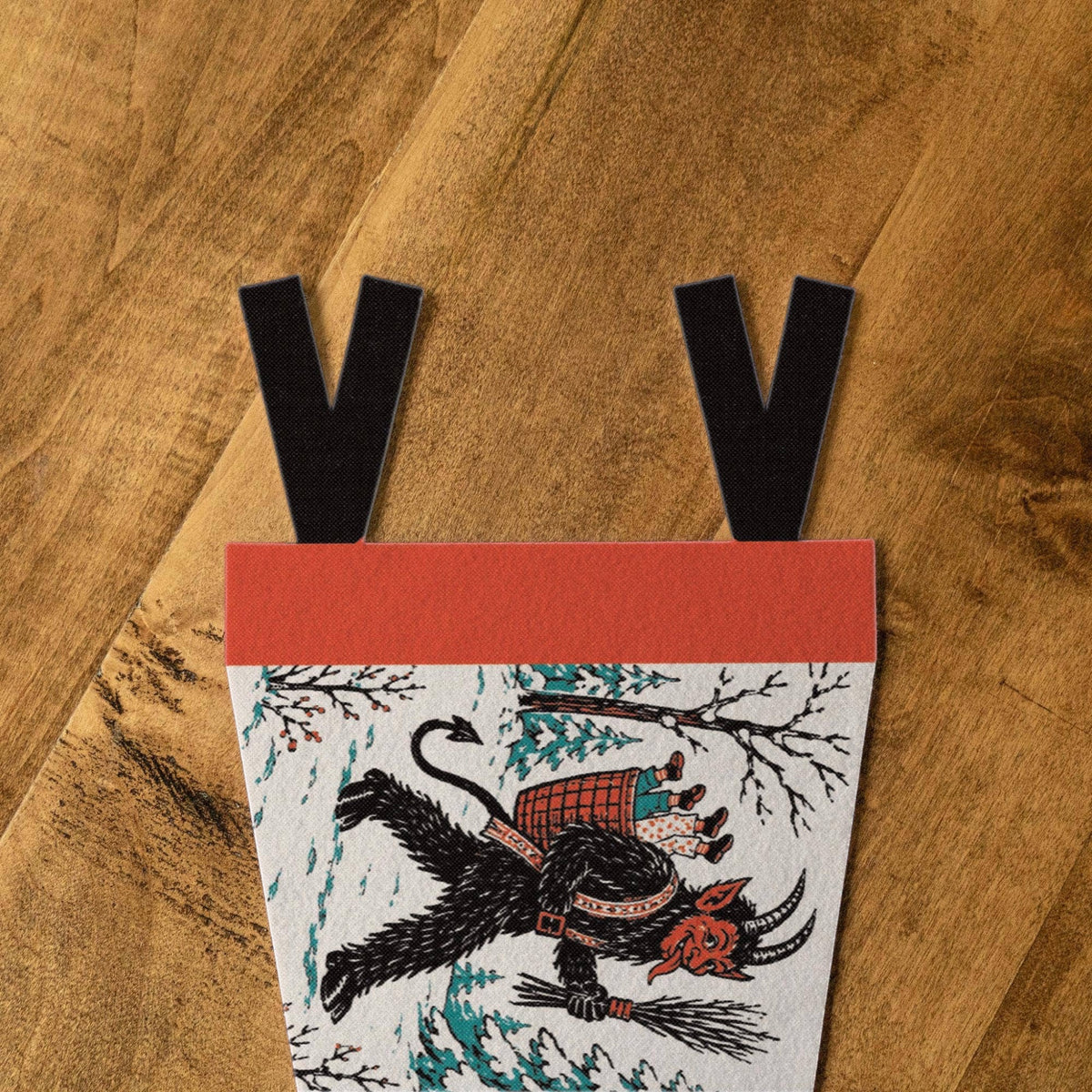 Forager Provisions LTD Krampus felt pennant featuring Season's Beatings text and vintage folklore illustration on wood.
