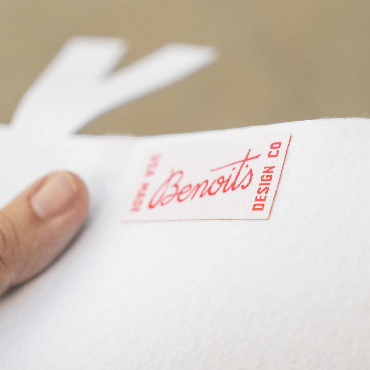 Forager Provisions LTD Benoit’s Supply Co. red and white fabric label on a white felt pennant