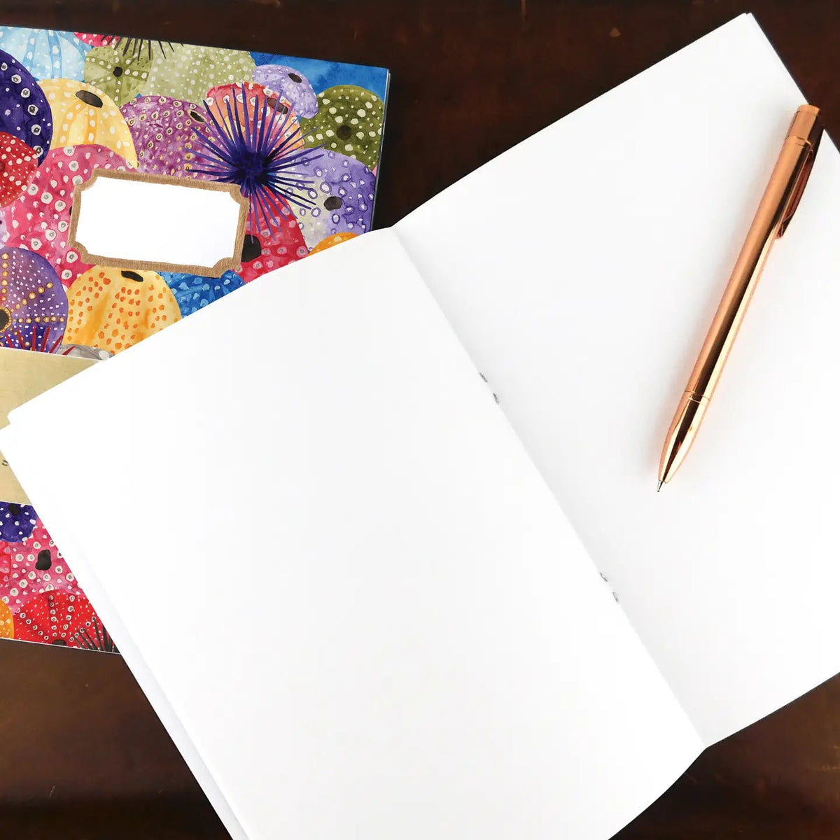 Forager Provisions LTD Bison Bindery A5 recycled notepad with sea urchin cover illustration and a rose gold pen