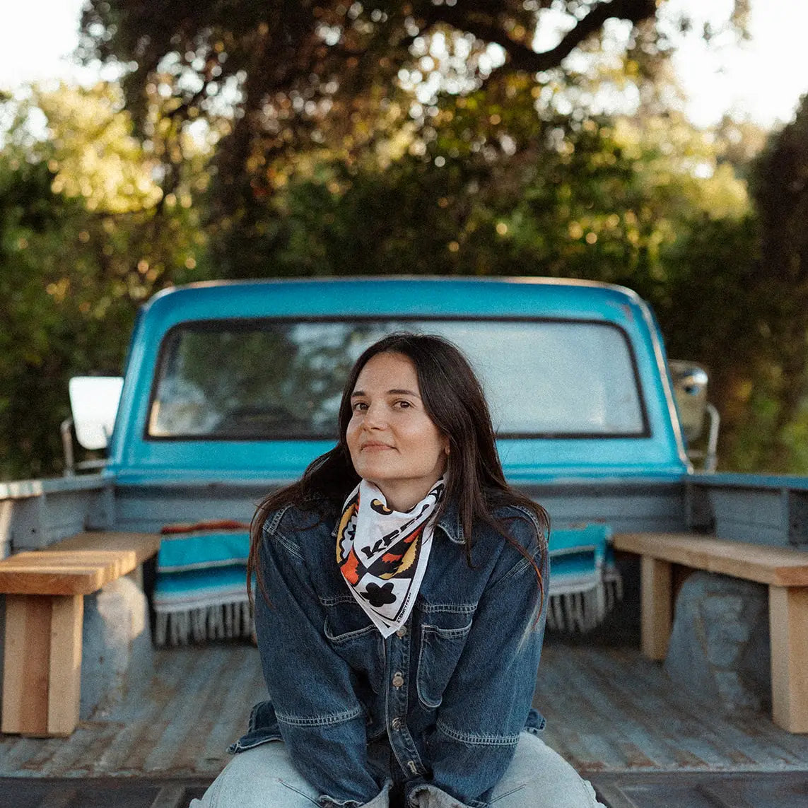 Forager Provisions LTD Bandits Bandanas Keep A Breast cotton bandana worn by a woman in a blue truck bed