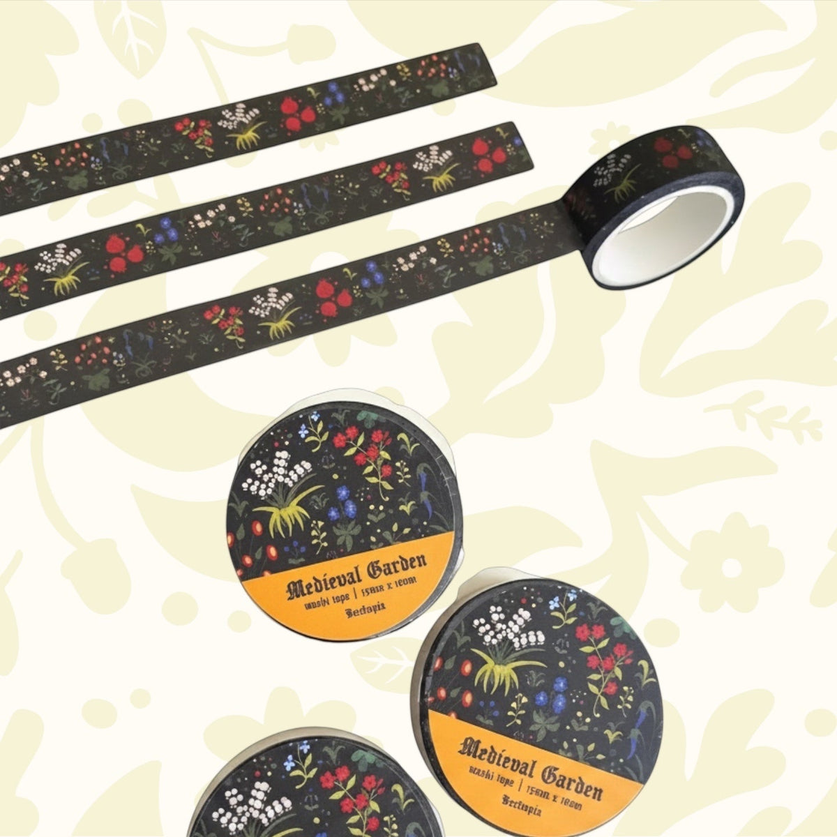 Beeftopia Medieval Unicorn Garden Washi Tape 15mm x 10m, decorative tape on notebook, with green leaves in background.