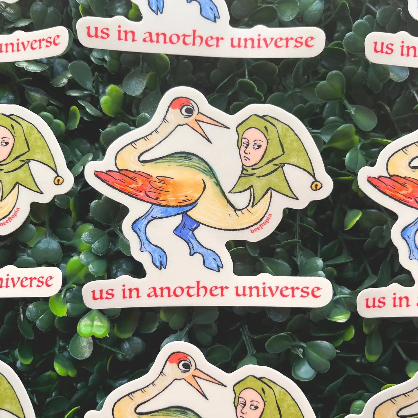 Beeftopia’s medieval-style sticker: bird with human legs and a person’s head, unique Us in Another Universe art design.