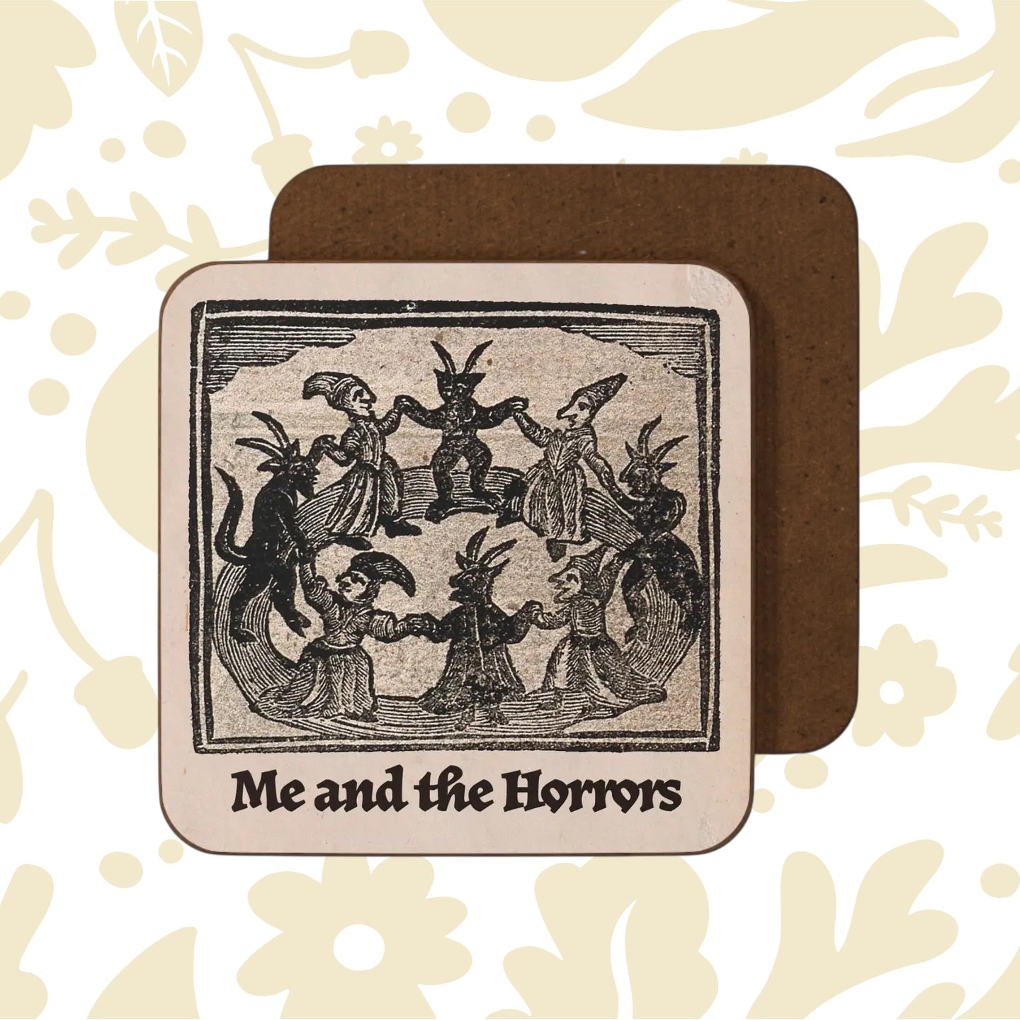 Betiobca Me and the Horrors gothic folklore coaster: animal-headed figures dancing in a circle, unique dark decor gift.