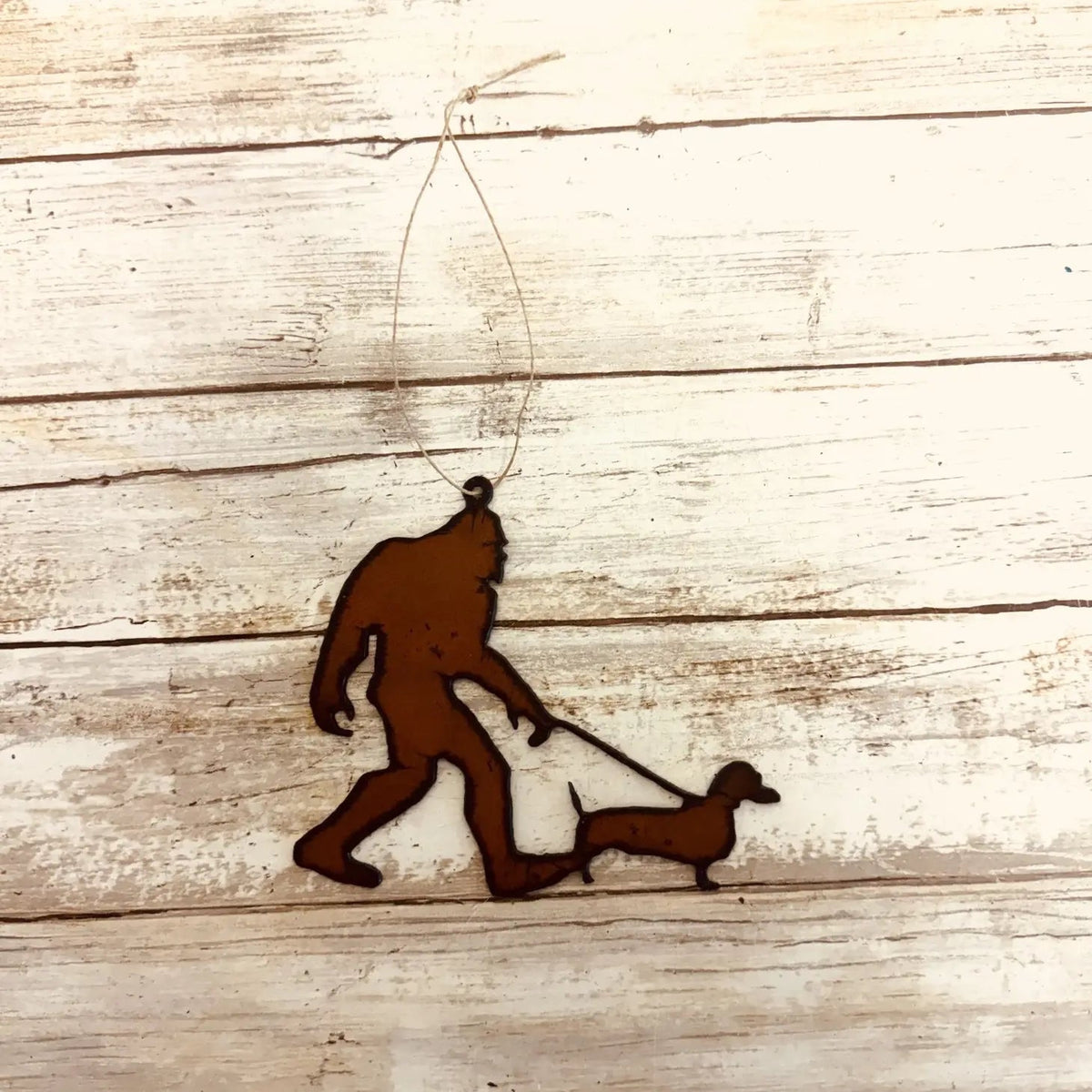 Universal Ironworks Bigfoot Yeti Sausage Dog Statue—funny dachshund decor, perfect unique gift for dog lovers and collectors.