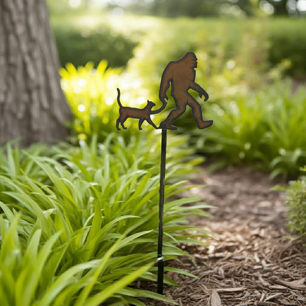 Forager Provisions LTD rustic metal Bigfoot and cat plant stick in a garden bed
