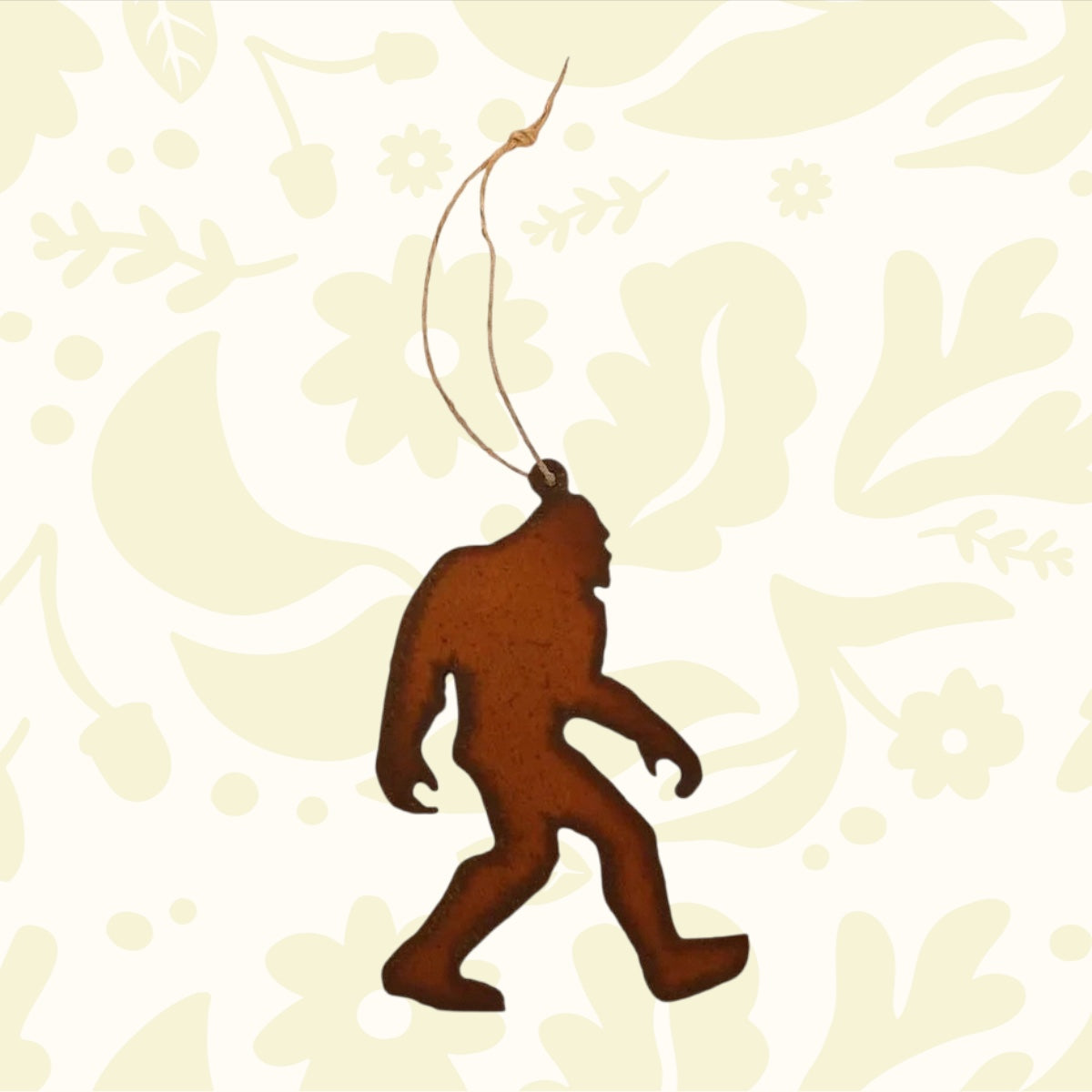 Universal Ironworks Bigfoot Walking Decor—rustic steel Sasquatch ornament, hanging with string loop, perfect for outdoor garden décor.