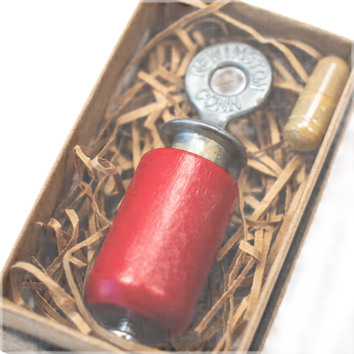 Vintage red Stemcell Audubon Bird Call with metal top, boxed with shredded paper. Shop at Stemcell Science Shop.