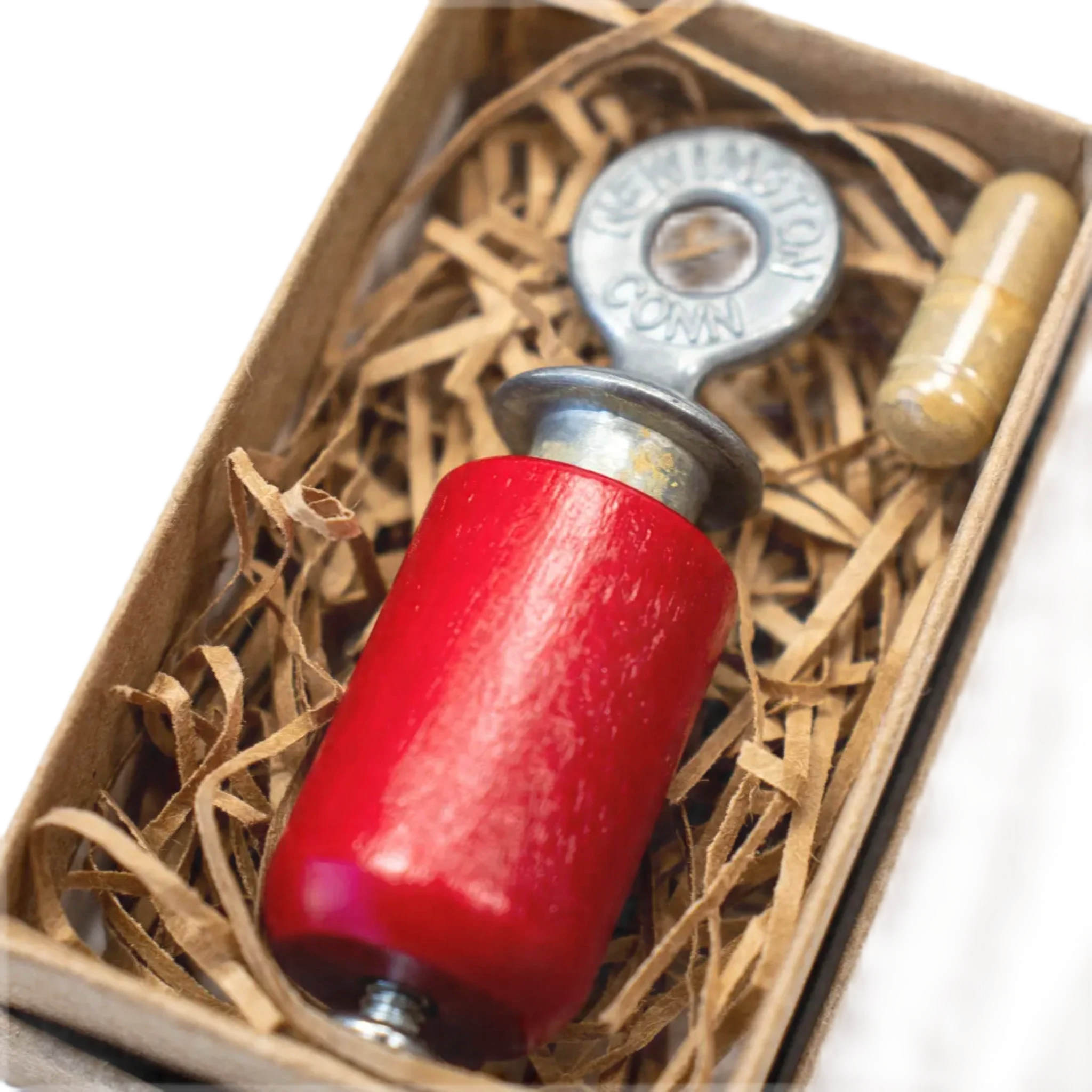 A cardboard box with an orange label featuring bird illustrations and the text "Stemcell Science Shop - Audubon Bird Call (Restock September 2024)" on a white background, contains a rosin capsule designed to imitate and attract birds.