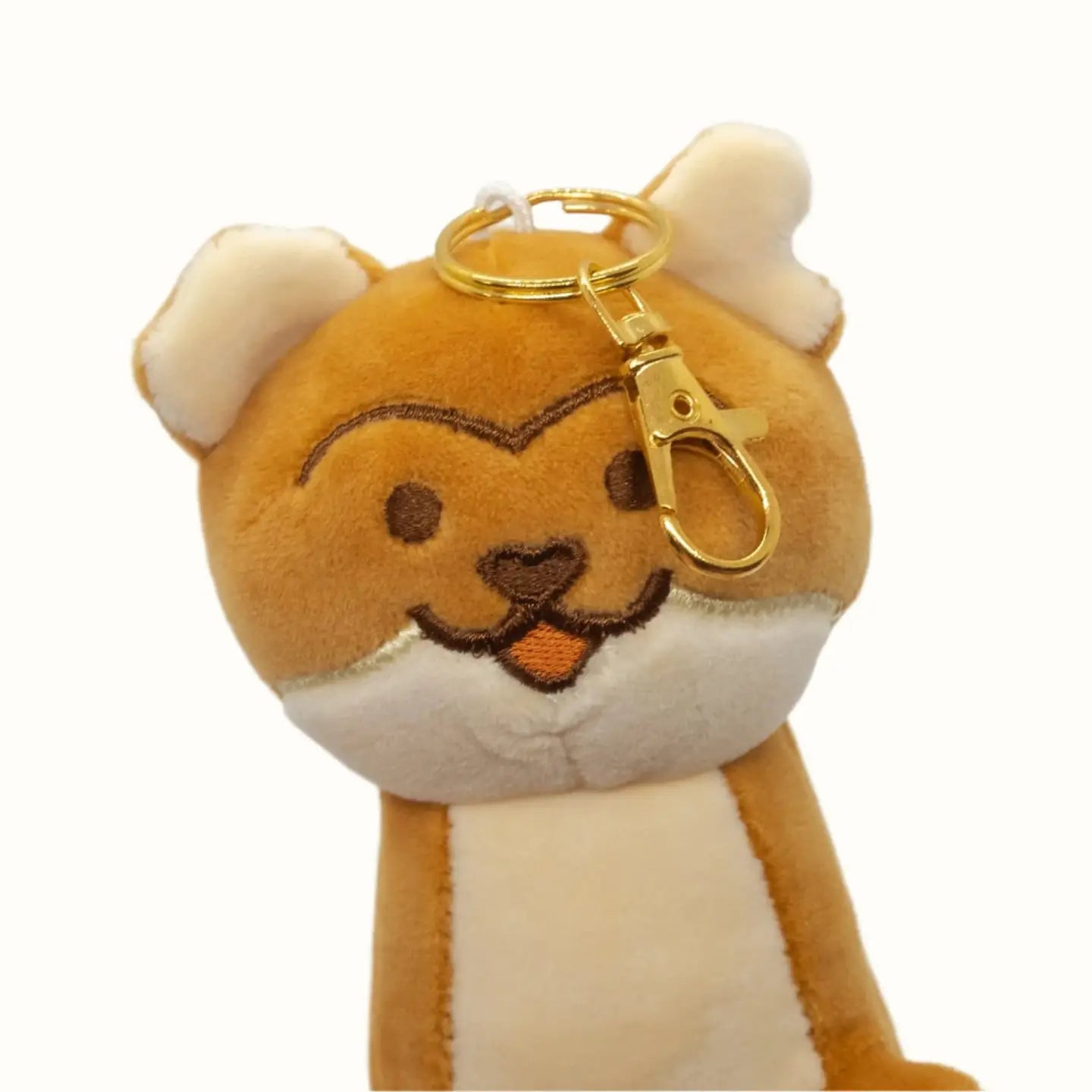 Plush stout-shaped keychain with a gold clip on a white background