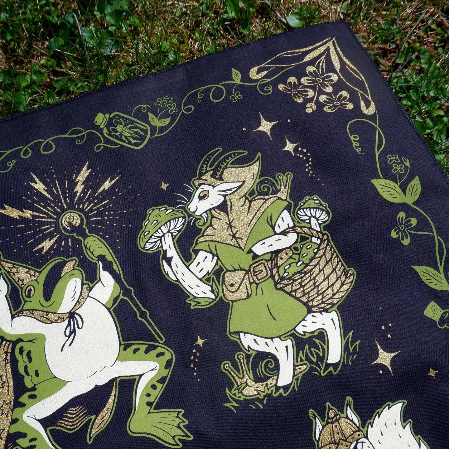 Forager Provisions LTD Cat Coven cotton bandana featuring whimsical fantasy frog and goat artwork in green and gold.