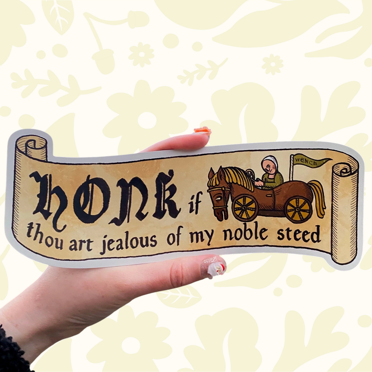Hand holds Clarice Tudor Medieval Noble Steed Magnetic Bumper Sticker, unique car accessory, medieval art by Clarice Tudor.