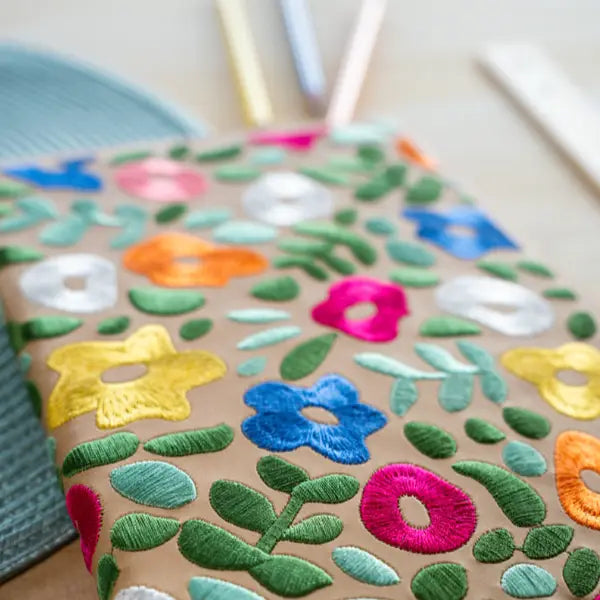 Forager Provisions LTD Denik journal with colourful embroidered floral patterns on a tan hardbound cover